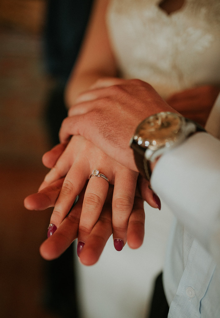 Wedding couple holding hands closeup. Woman`s ring closeup. by shixart1985 interracial marriage photo
