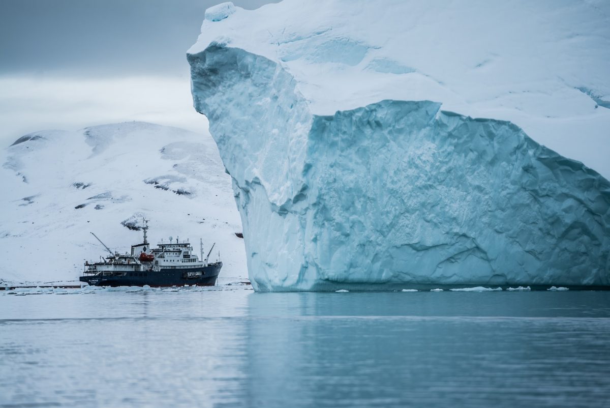 boat beside iceberg