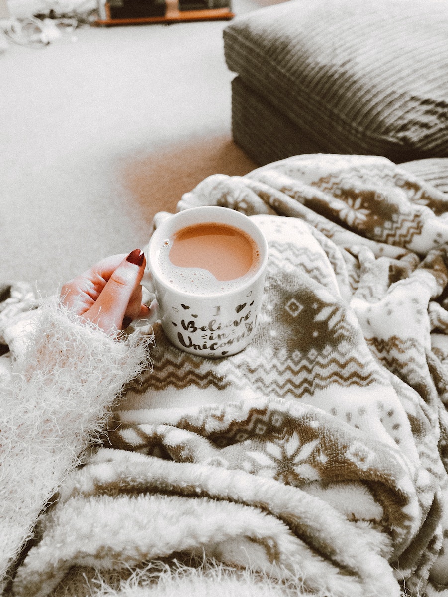 Person Holding Coffee Filled Mug