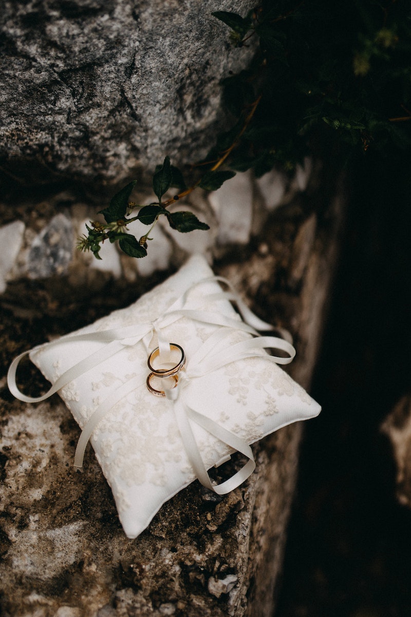 Two Gold Rings On A Silk Cushion
