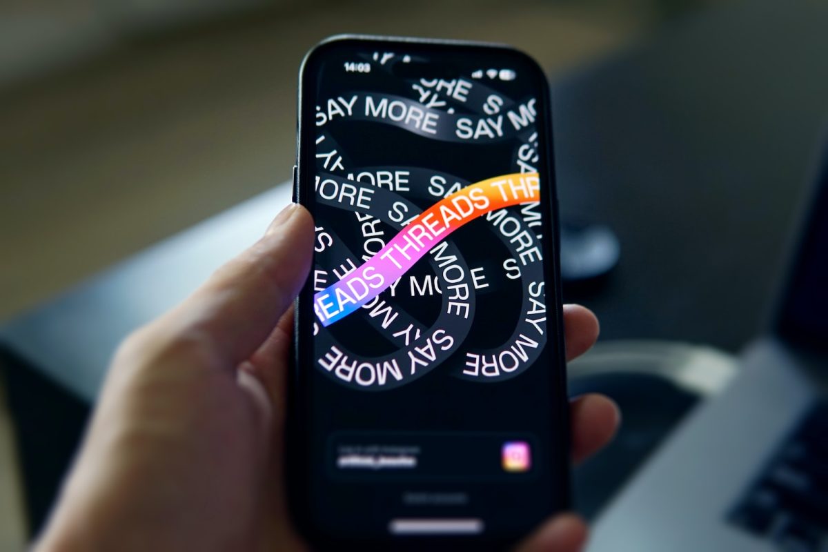 a person holding a cell phone with a message on it