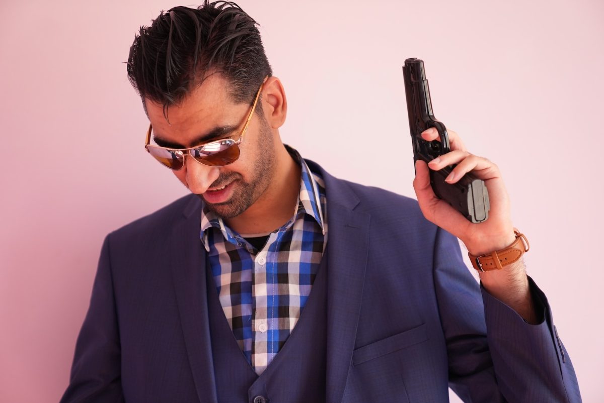 a man in a suit holding a cell phone