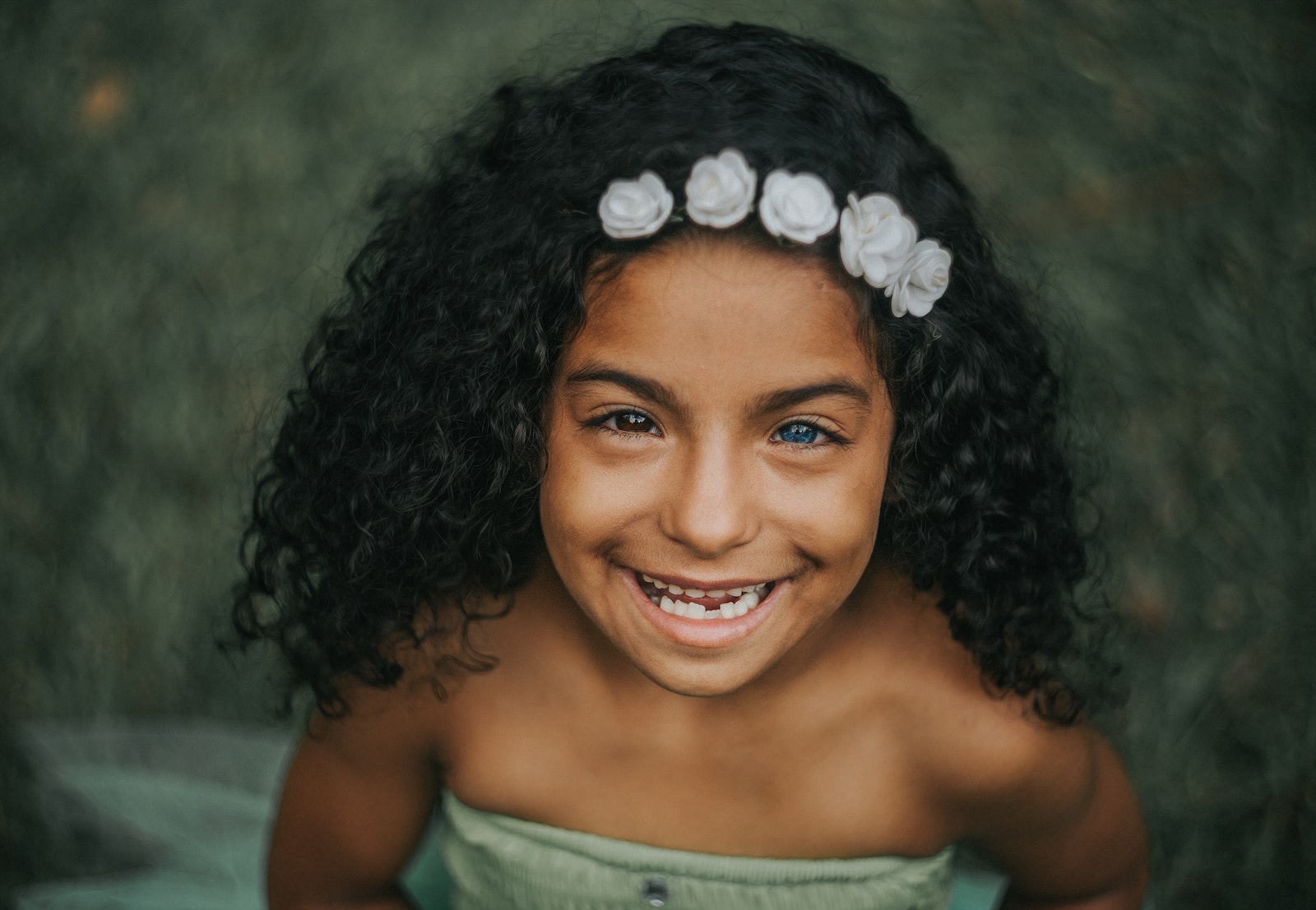 A Girl Smiling with Curly Hair