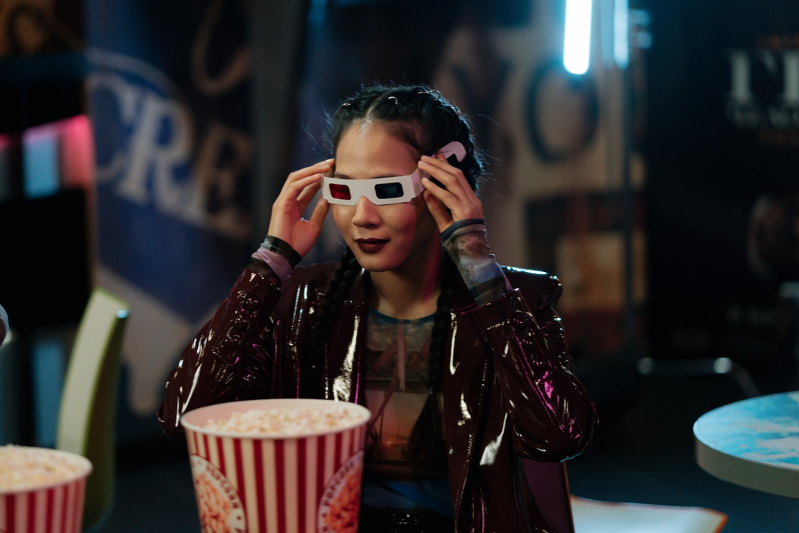 Woman in Leather Jacket Holding Her 3D Glasses