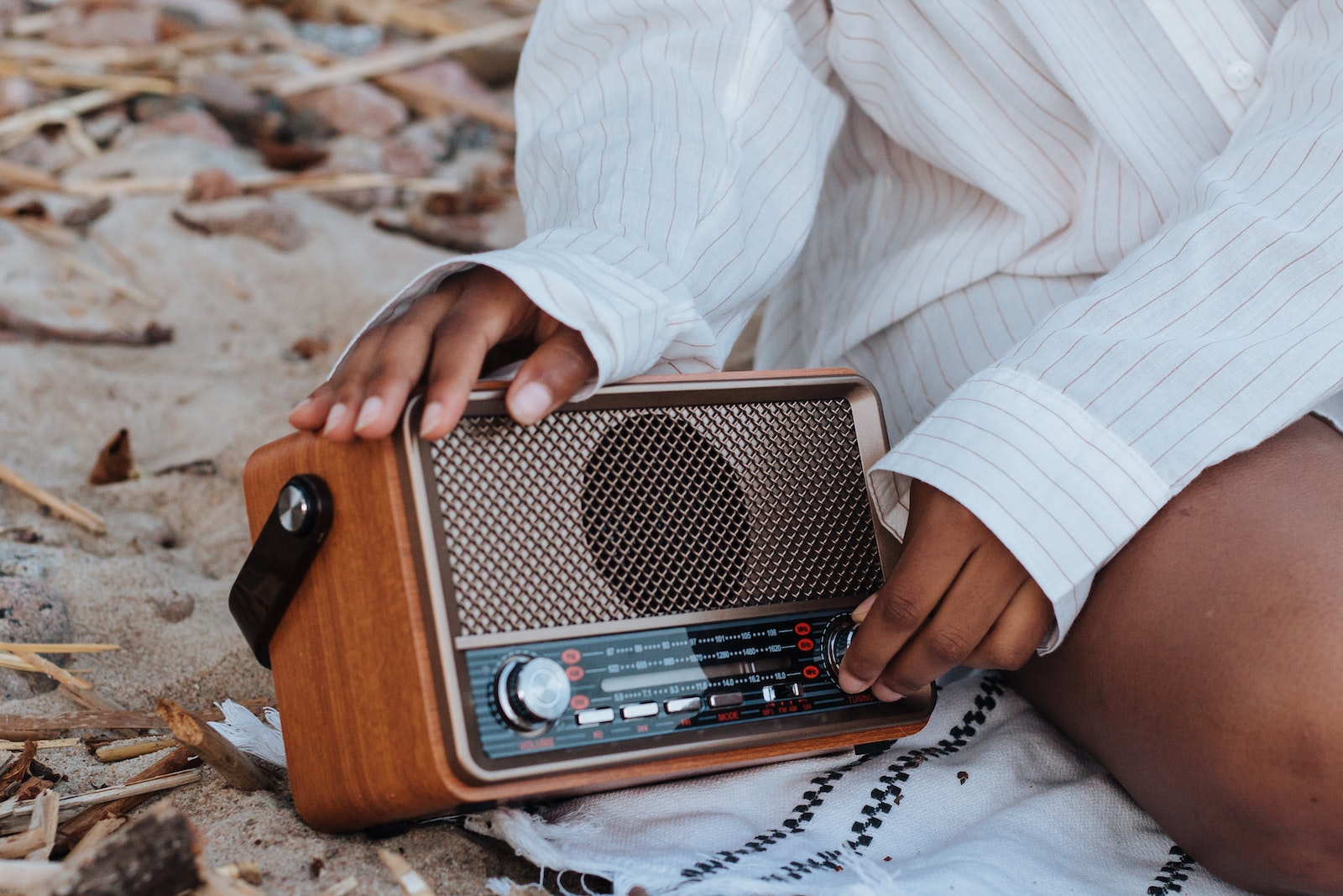Female Hands Holding a Radio