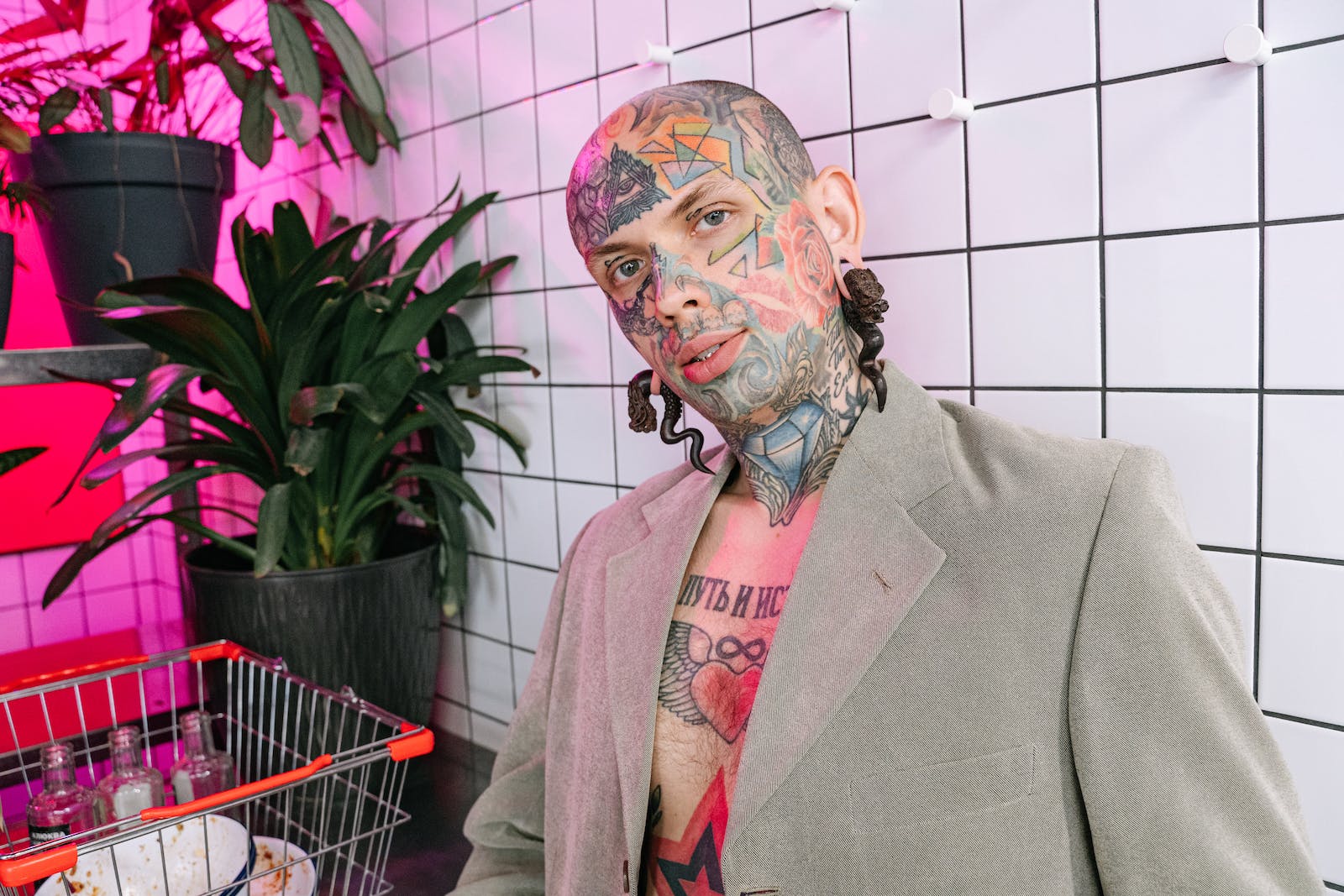 Man in Gray Blazer with Tattoo on Face