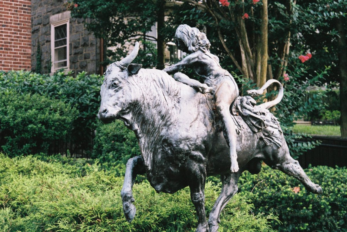 a statue of a person riding a horse