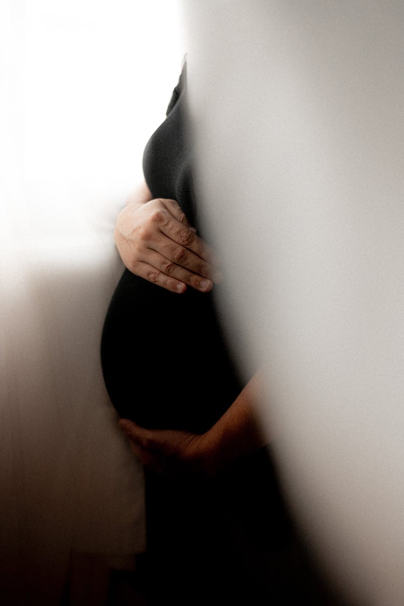 Woman Holding her Pregnant Belly