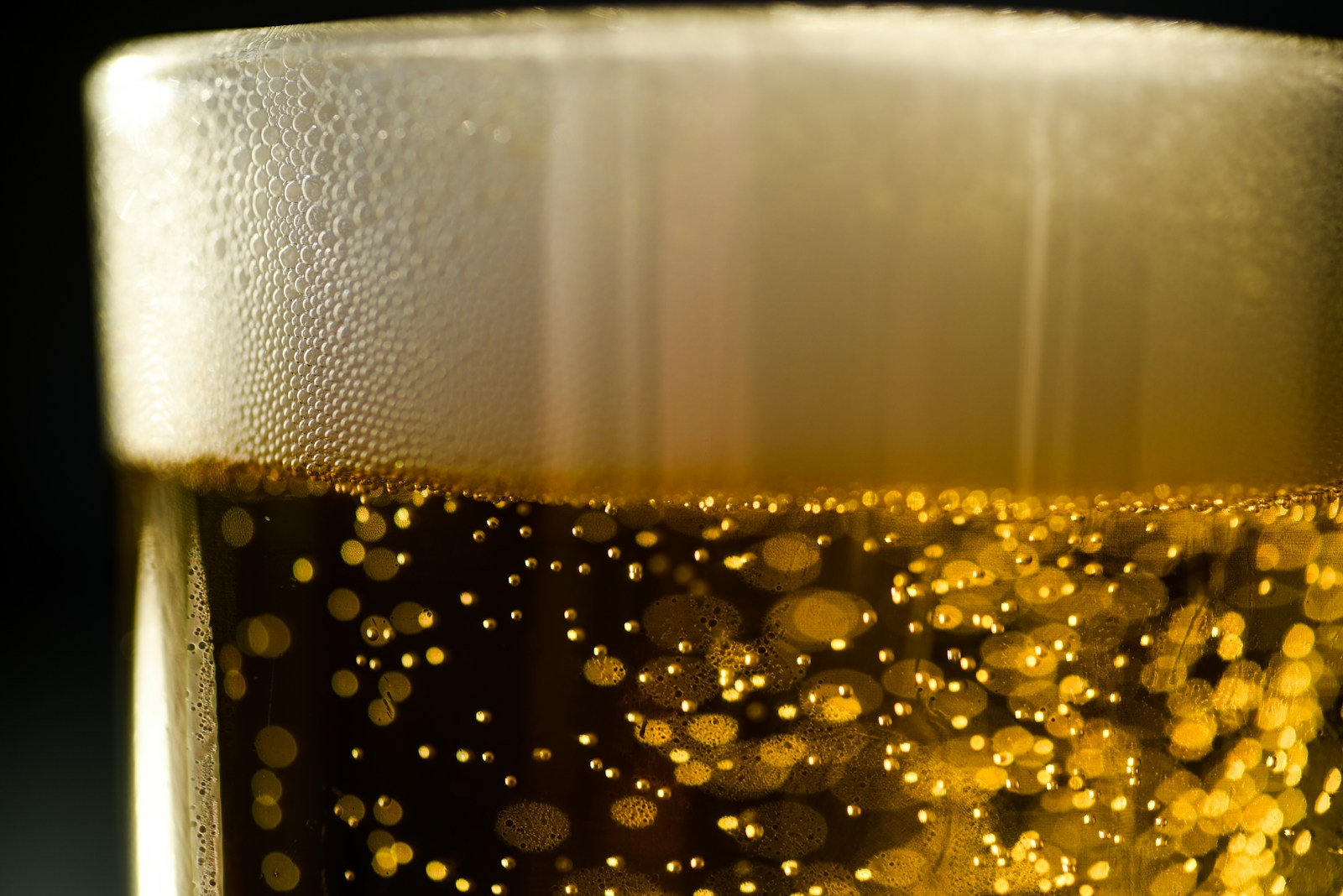a close up of a glass of beer
