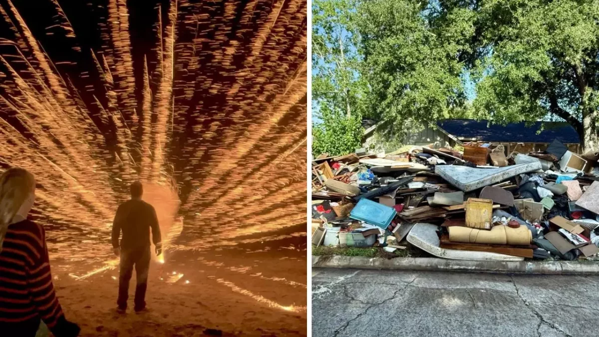 Osoba pred ohňostrojom a hromada odpadu pred domom pod stromami.