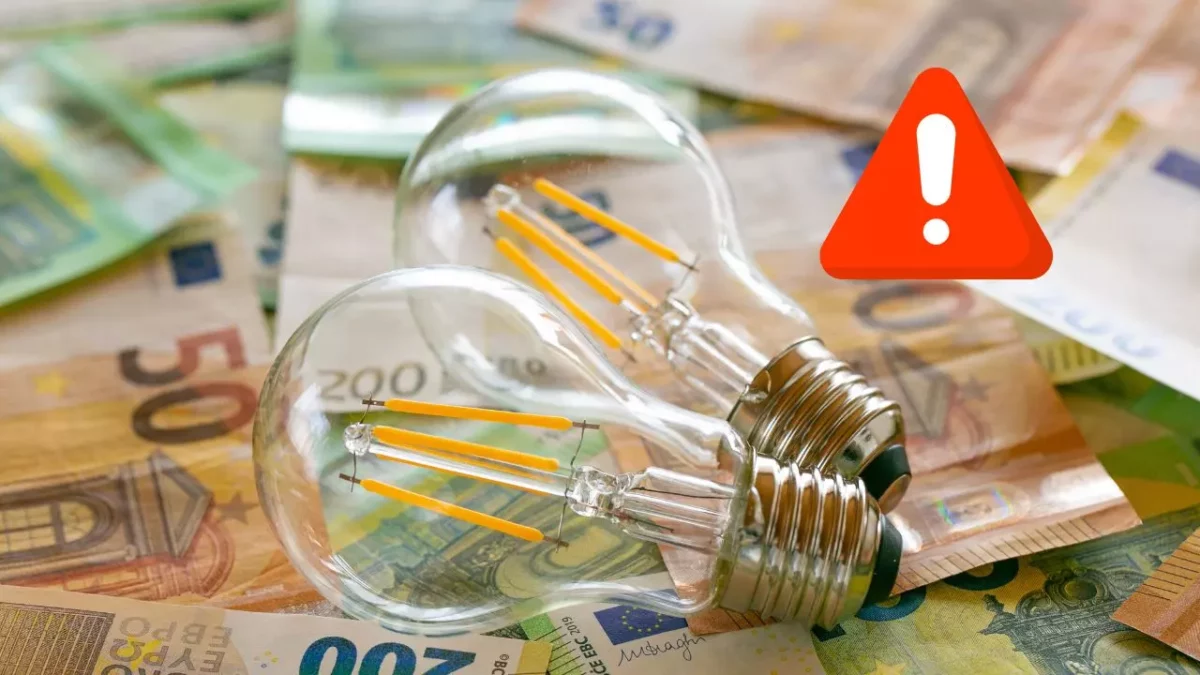 Žiarovky na eurobankovkách s výstražným symbolom: Upozornenie na rastúce náklady na energiu a spotrebu.