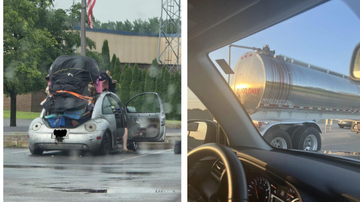 Auto preťažené batožinou vedľa cisterny s nápisom Len krv, pohľad z auta v daždi.
