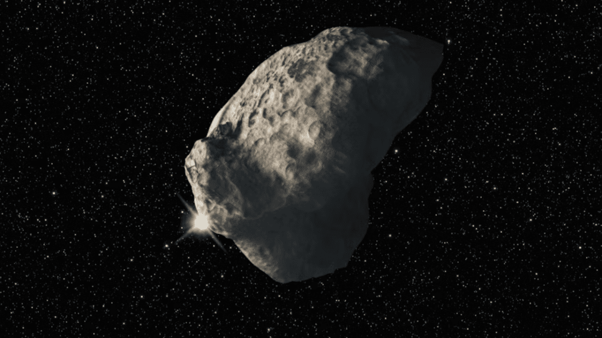 Obrázok vesmírneho asteroidu proti hviezdnemu pozadiu.