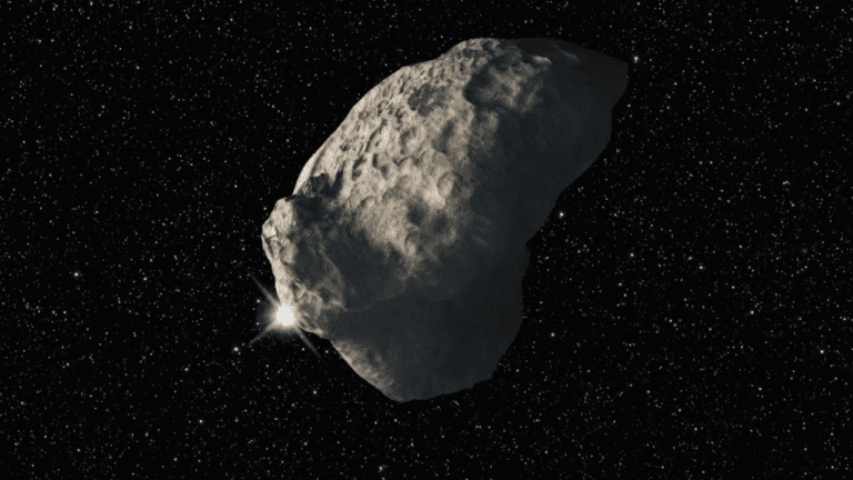 Obrázok vesmírneho asteroidu proti hviezdnemu pozadiu.