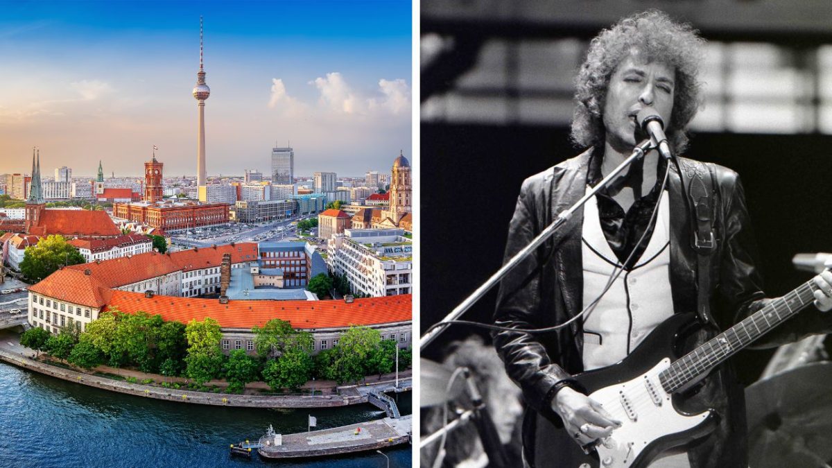 Panoráma Berlína s televíznou vežou a hudobník s gitarou na pódiu.