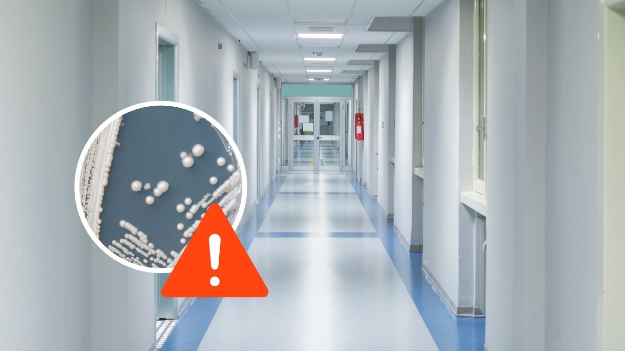 Chodba v nemocnici s upozornením na baktérie; nákaza a čistota zdravotníckeho prostredia.