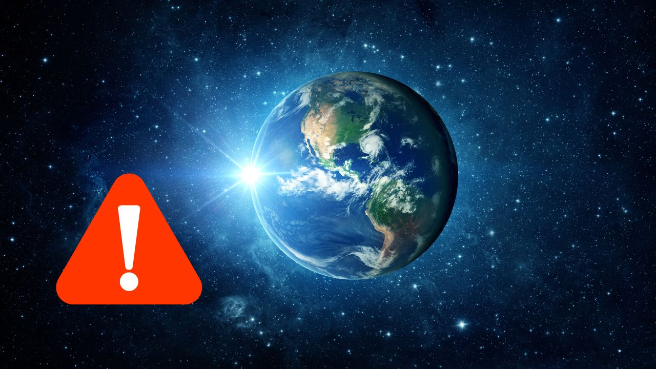 Zem v vesmíre s varovným symbolom. Upozornenie na environmentálne problémy alebo hrozby planéty.