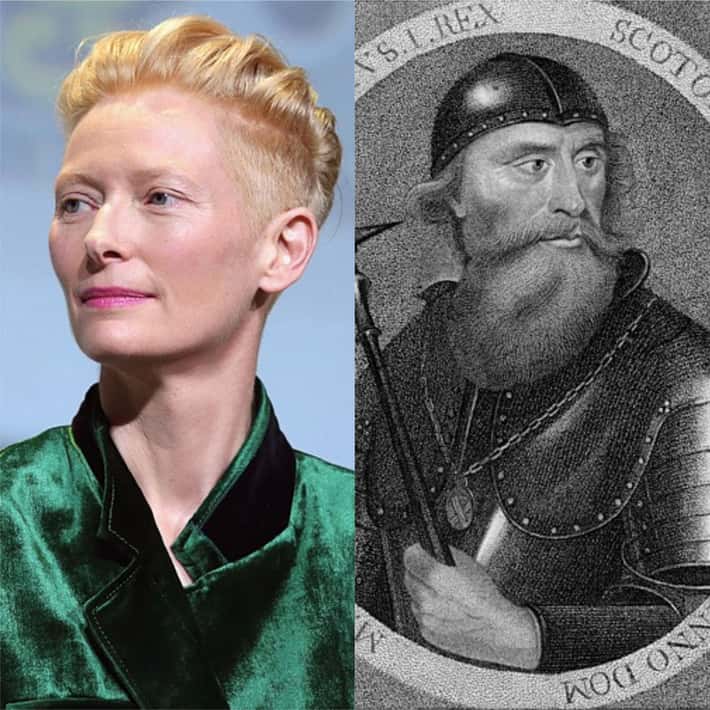 Osoba v zelenom saku vedľa historického portrétu muža v helmici s bradou.
