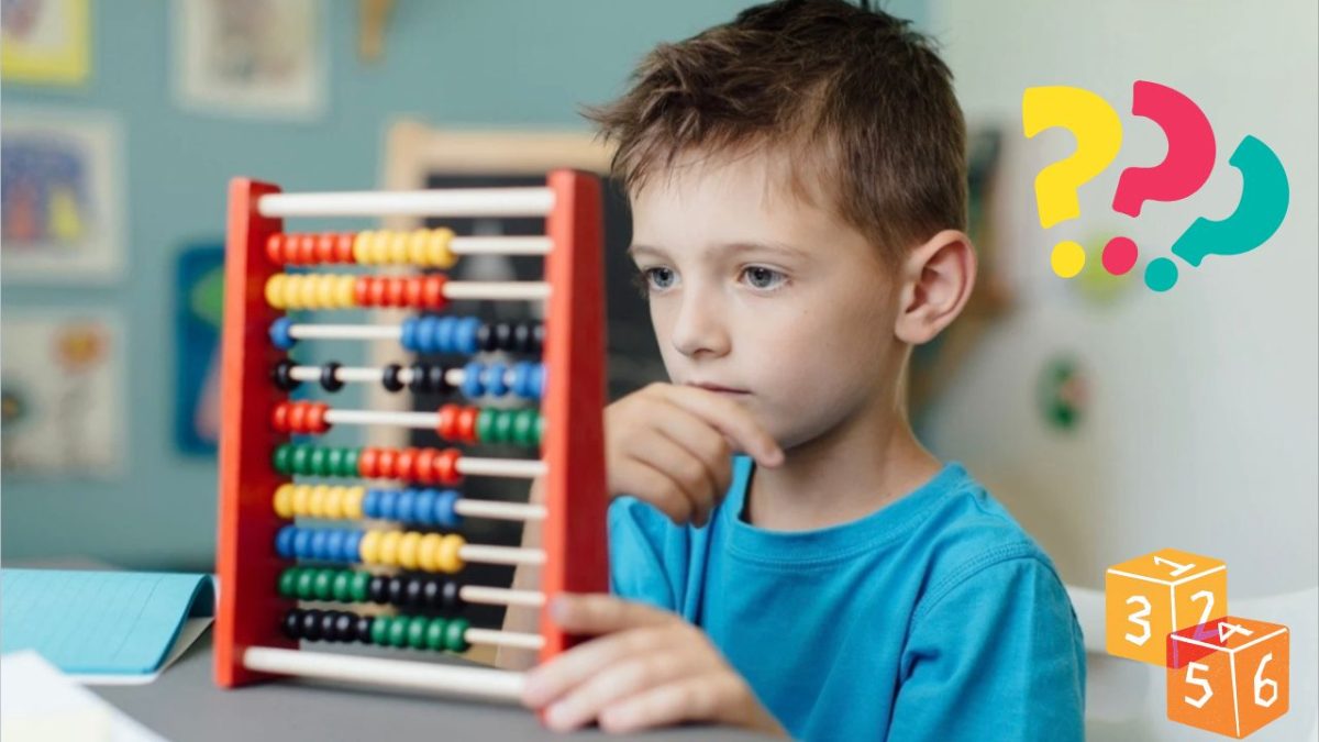 Chlapec používa farebné počítadlo na učenie matematiky, sústredene premýšľa nad úlohou.