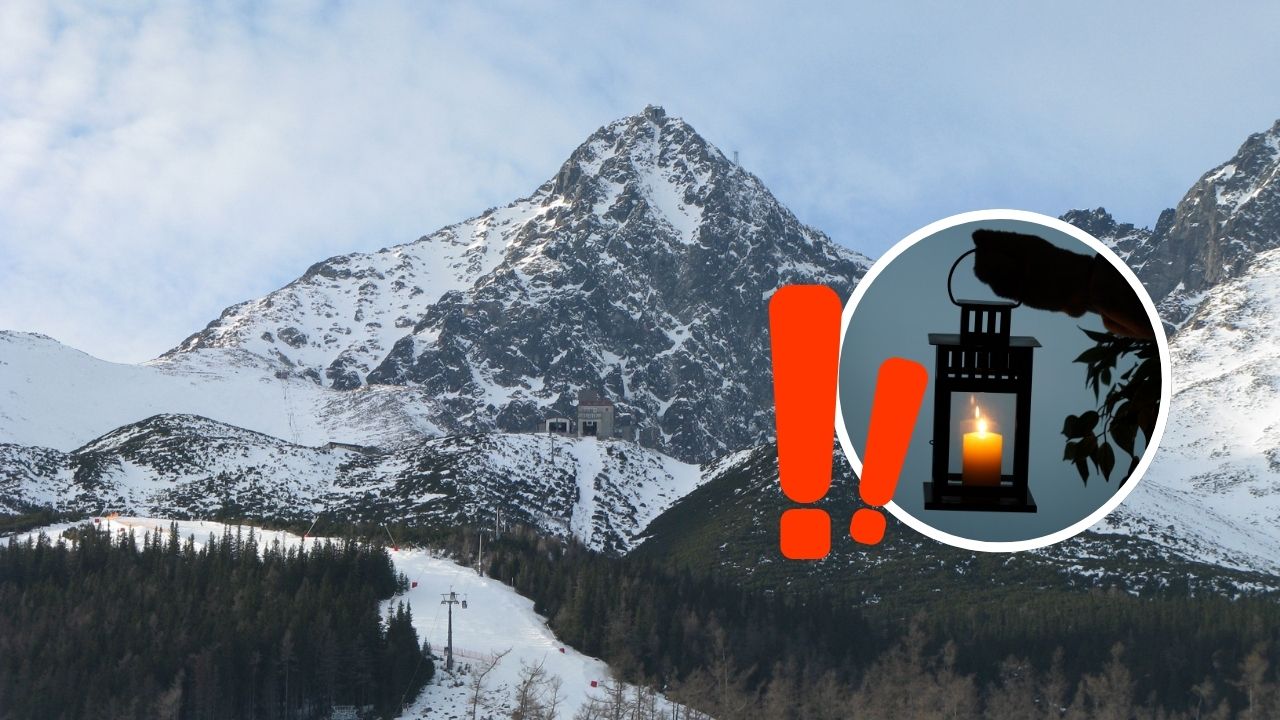 Horský vrch siahajúci k nebu, zimná krajina a lampáš s plameňom, symbolizuje pokoj a tajomstvo zimného večera.