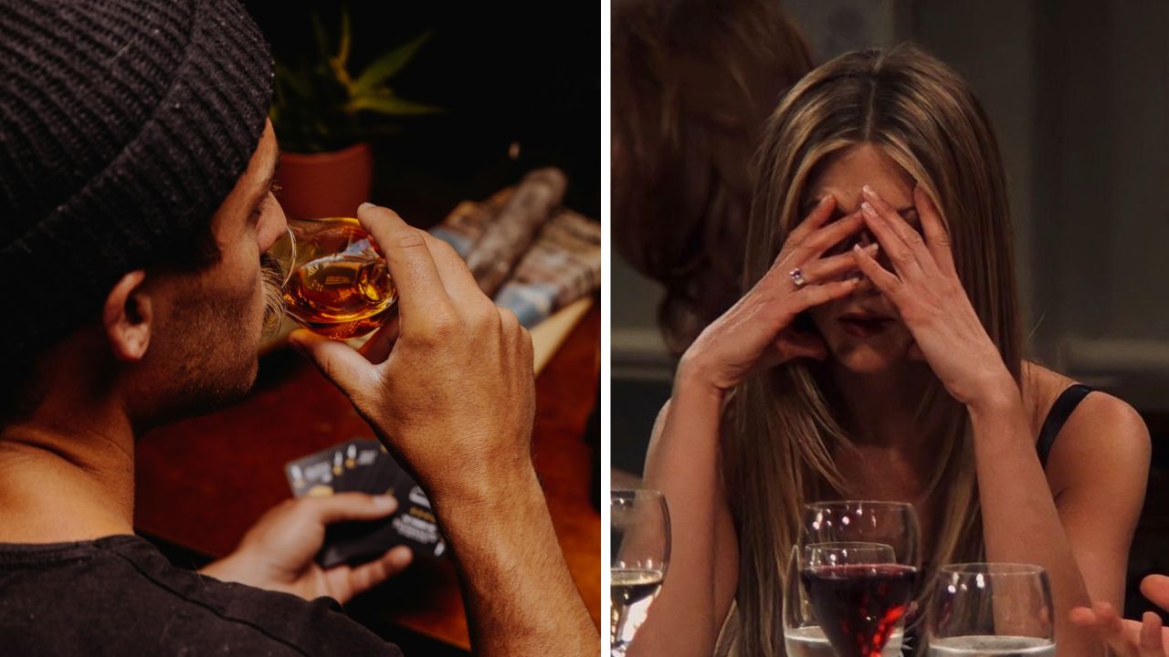 Osoba pijúca alkohol, zatiaľ čo druhá osoba si schováva tvár v rukách za stolom s pohármi vína.